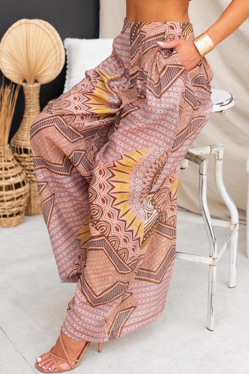 Halia Pants featuring abstract print, mid-high waist fit, and pockets in a light, lined material.