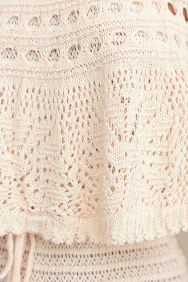 Close-up of the crochet material of the Elva Maxi Dress featuring detailed open weave design.