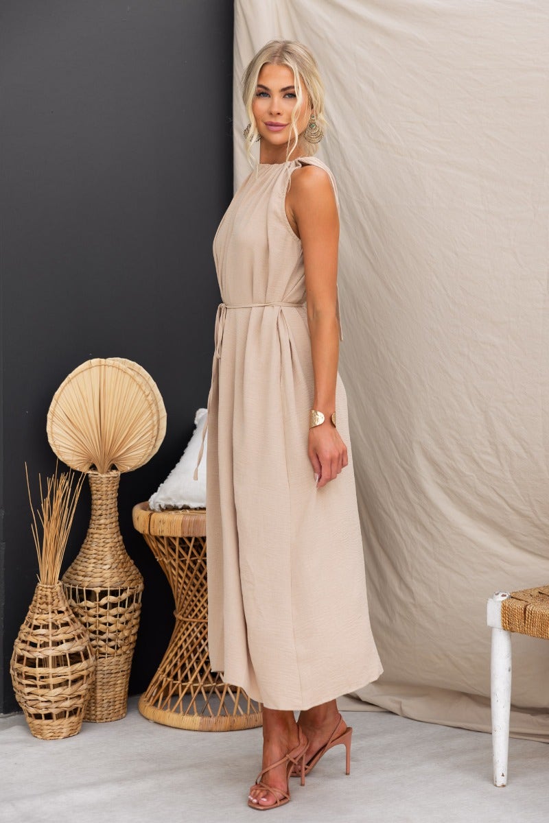 Iwaki Maxi Dress in beige, featuring adjustable tie neckline and oversized fit, perfect for casual summer outings.
