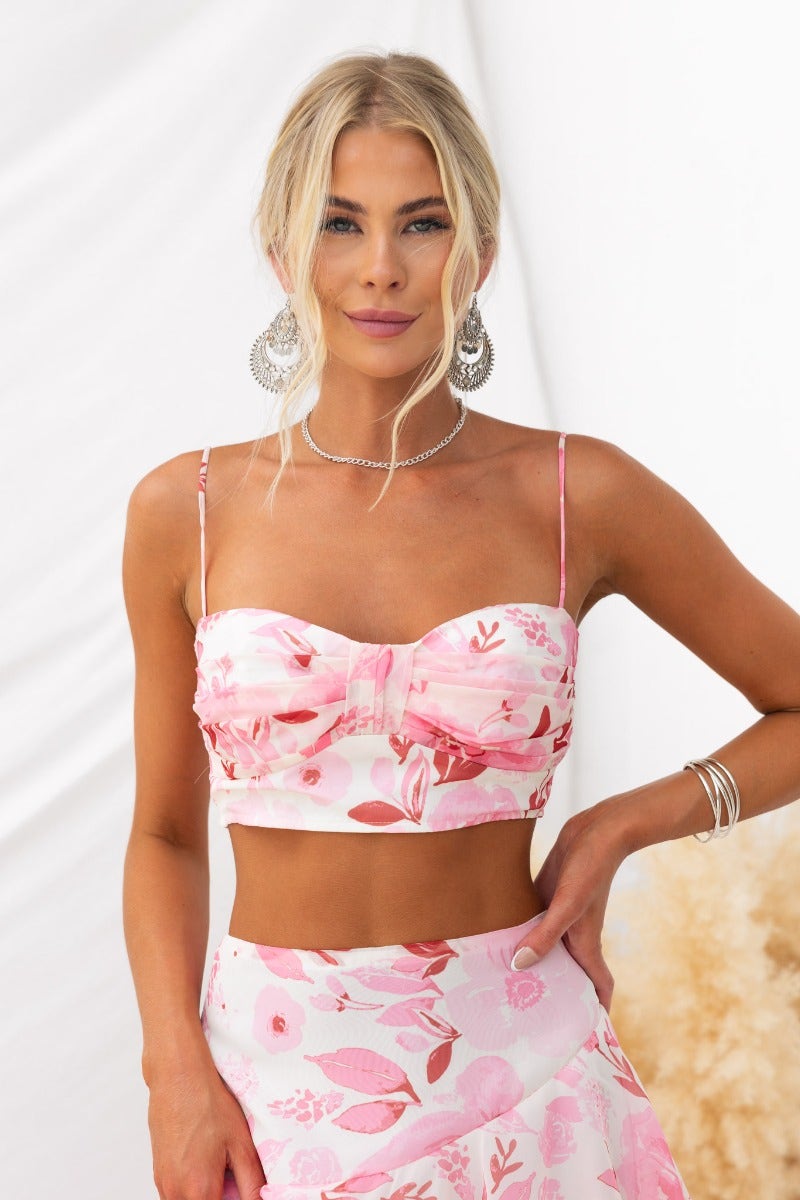 Saphina Top with floral print, adjustable straps, and chiffon material, worn with coordinated floral skirt.