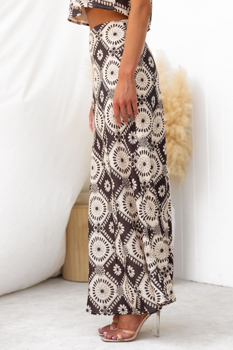 Side view of Theda Maxi Skirt in floral print, showcasing mid-high waist fit and elegant linen look.