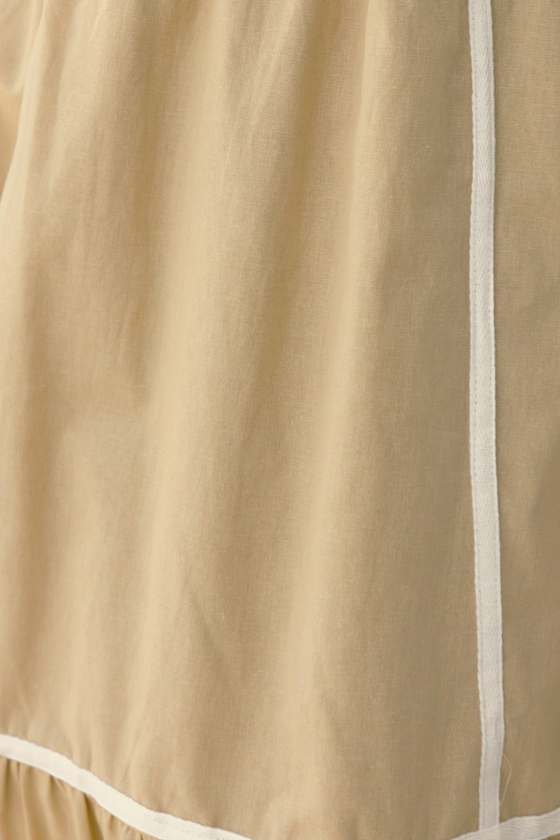 Close-up of Cianna Midi Dress fabric, showcasing light cotton texture and contrast stitching details.