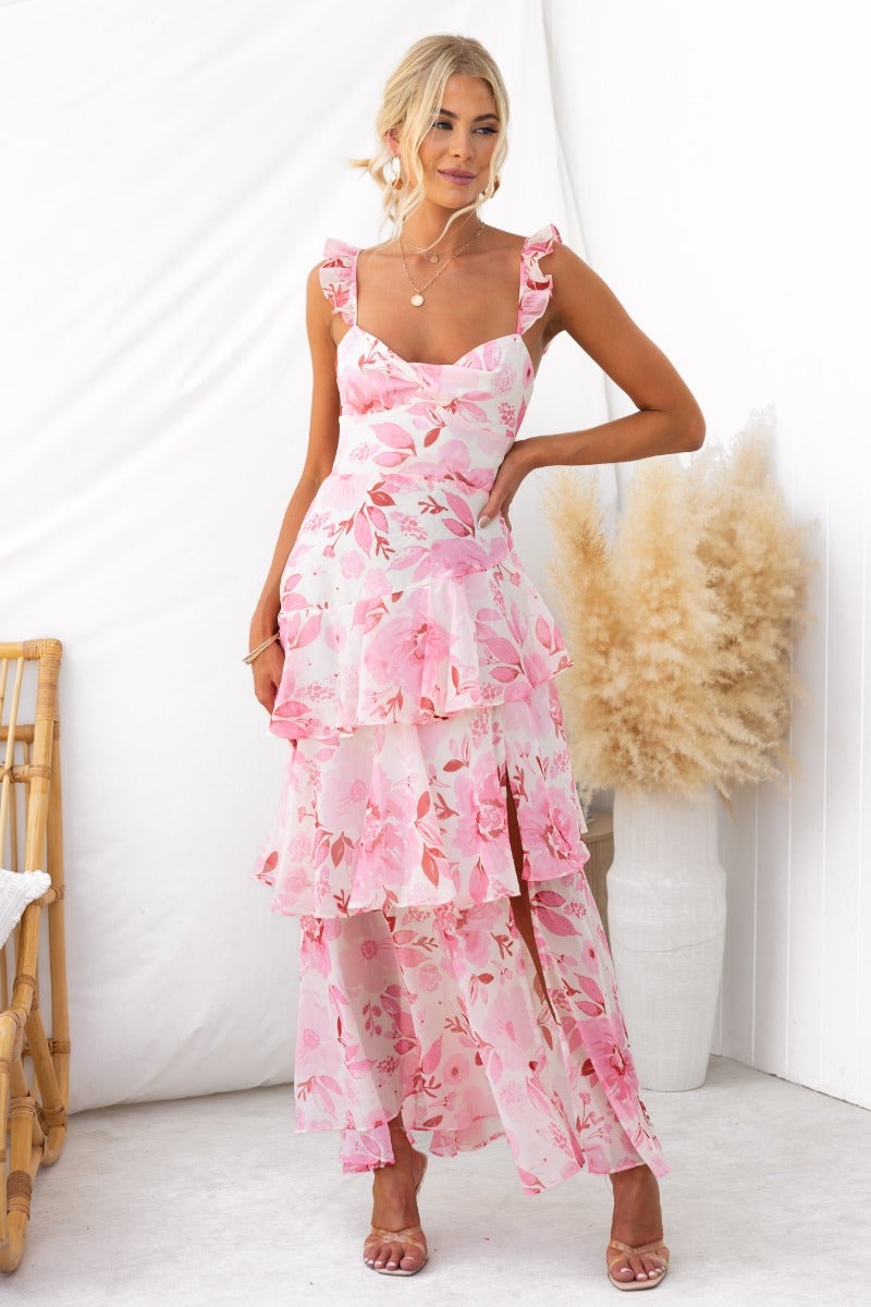 Floral print Klaudia Maxi Dress featuring adjustable tie straps and flowy ruffles.