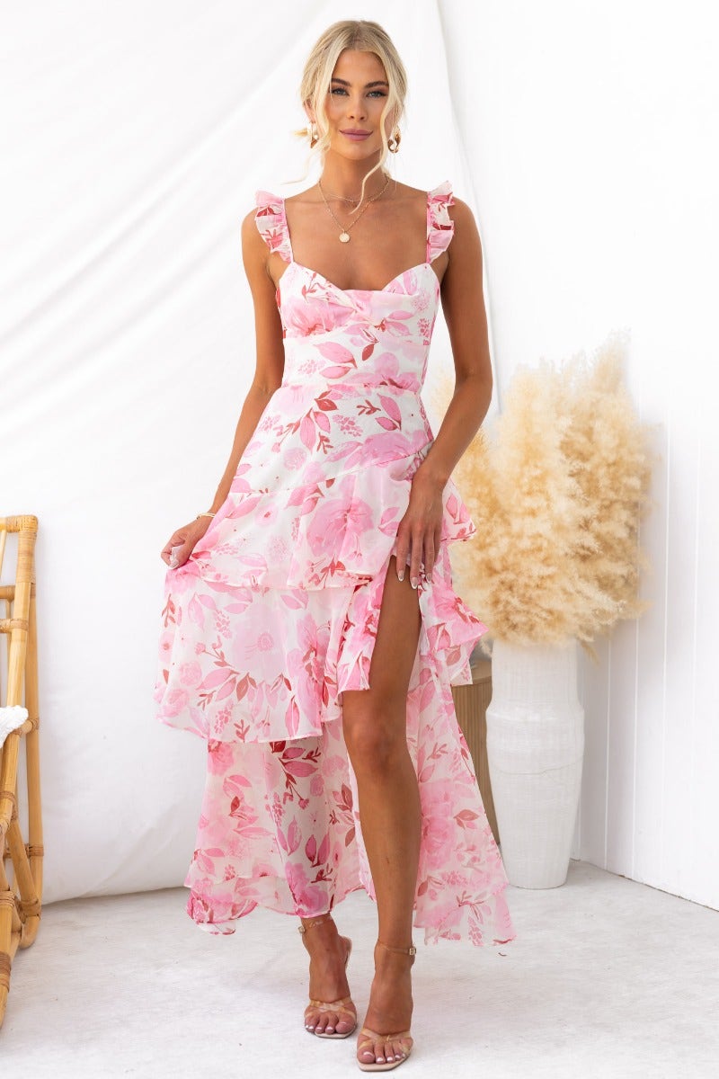 Klaudia Maxi Dress in pink floral print with ruffled straps and front split, perfect for summer occasions.