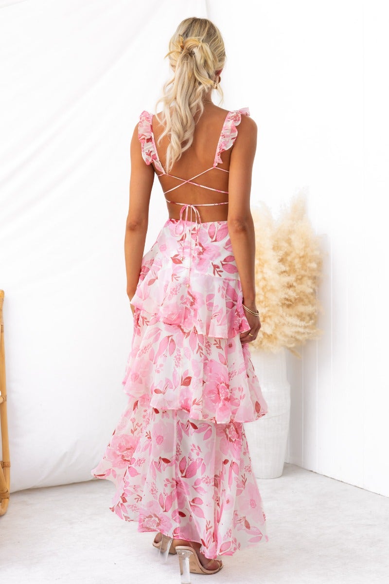 Back view of Klaudia Maxi Dress with floral print, ruffled straps, and layered chiffon design, ideal for summer occasions.