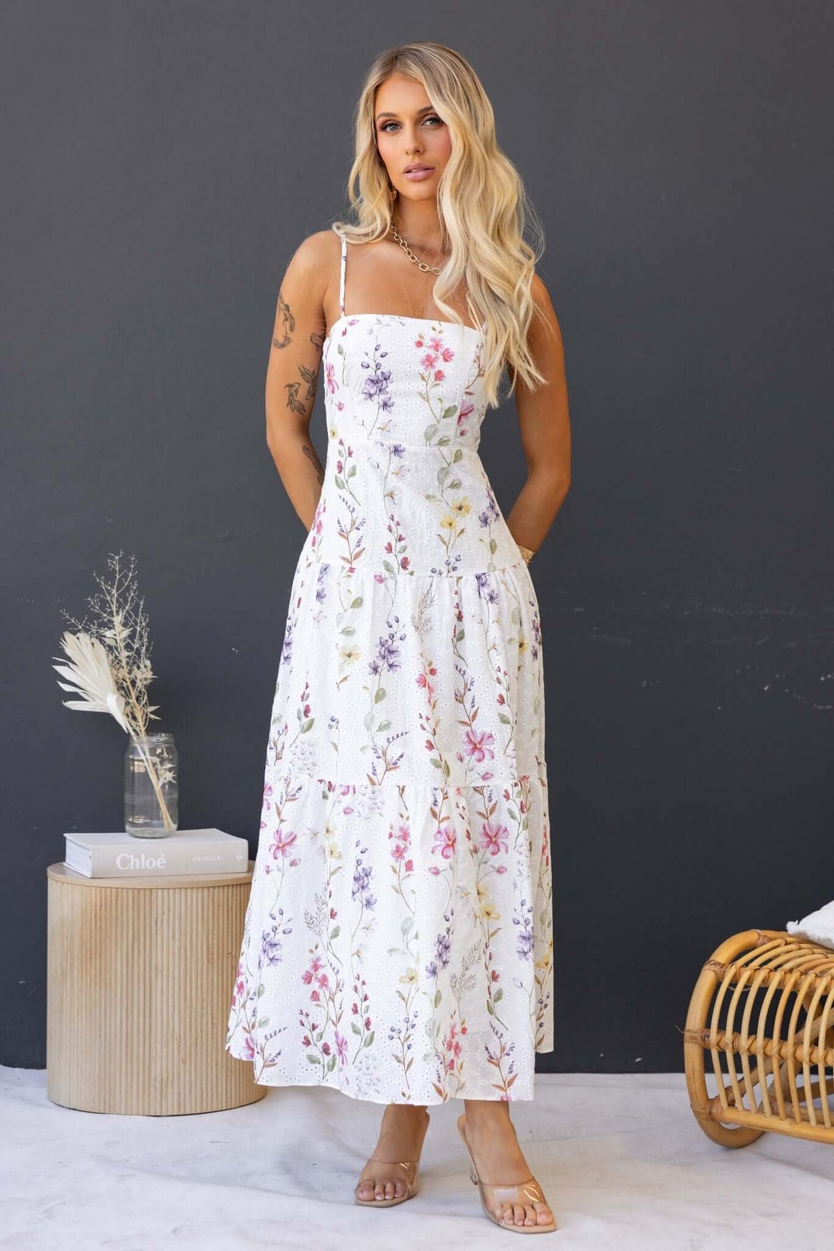 Floral print Carlyle maxi dress with adjustable straps, model showcasing elegant summer style.