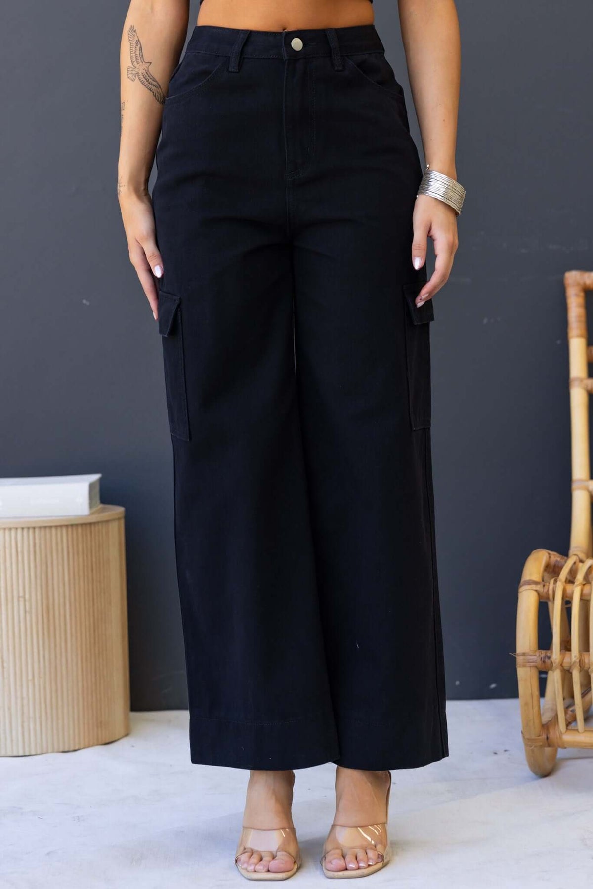 Chandler Jeans in black, featuring wide cargo legs, mid-high waist, and multiple pockets for a stylish and functional look.