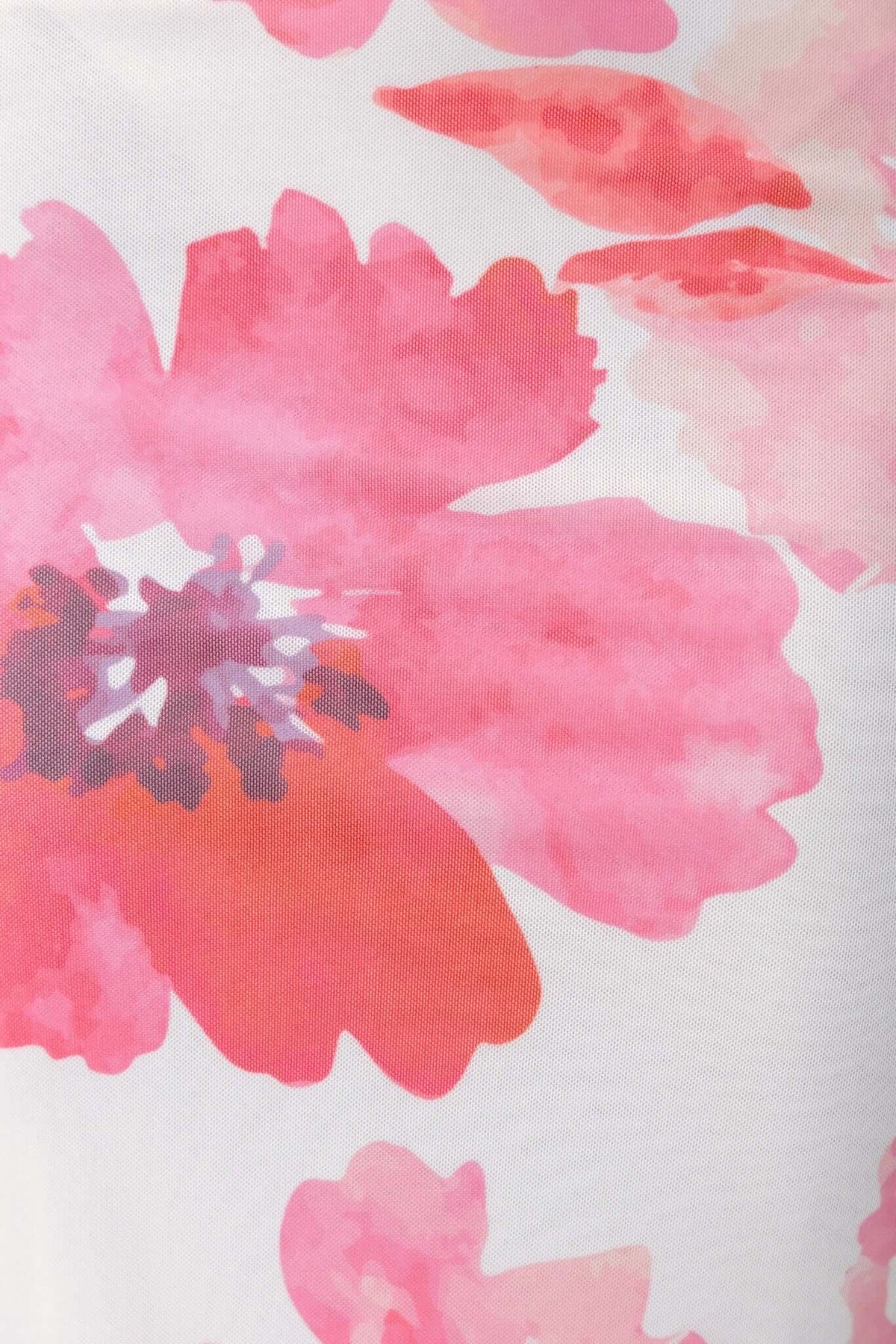 Close-up of pink floral pattern on the Manduria Maxi Dress, featuring vibrant blossoms in soft watercolor style.