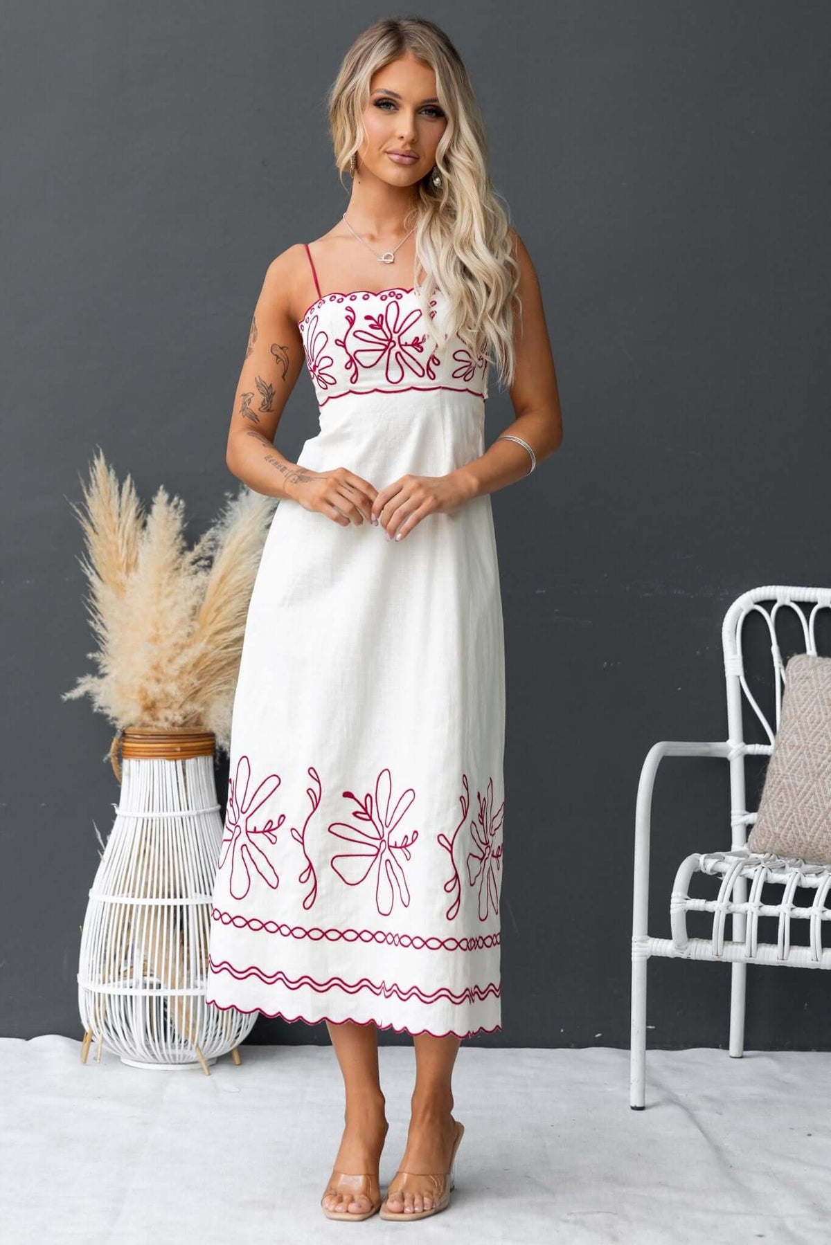 Homestead Midi Dress featuring adjustable straps, floral embroidery, and a relaxed fit, ideal for summer outings.