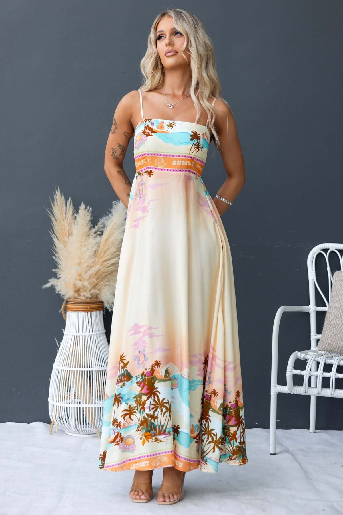 Elegant Salilah Maxi Dress with adjustable straps and floral print, perfect for summer outings.