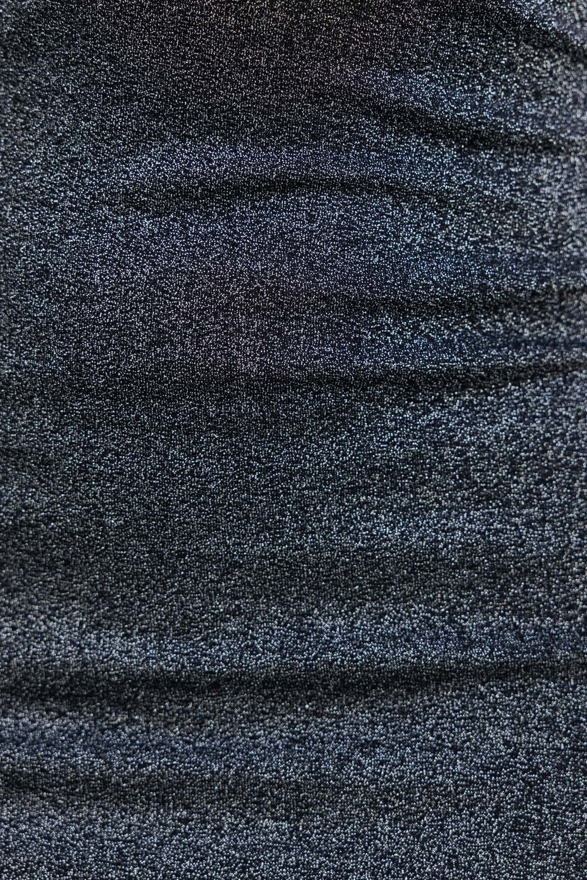 Close-up of metallic black fabric of Ellodia Midi Dress, showcasing its unique texture and shimmer.