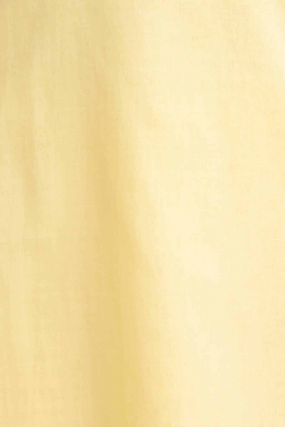 Close-up of soft yellow fabric, showcasing a smooth texture for the Palomia Midi Dress.