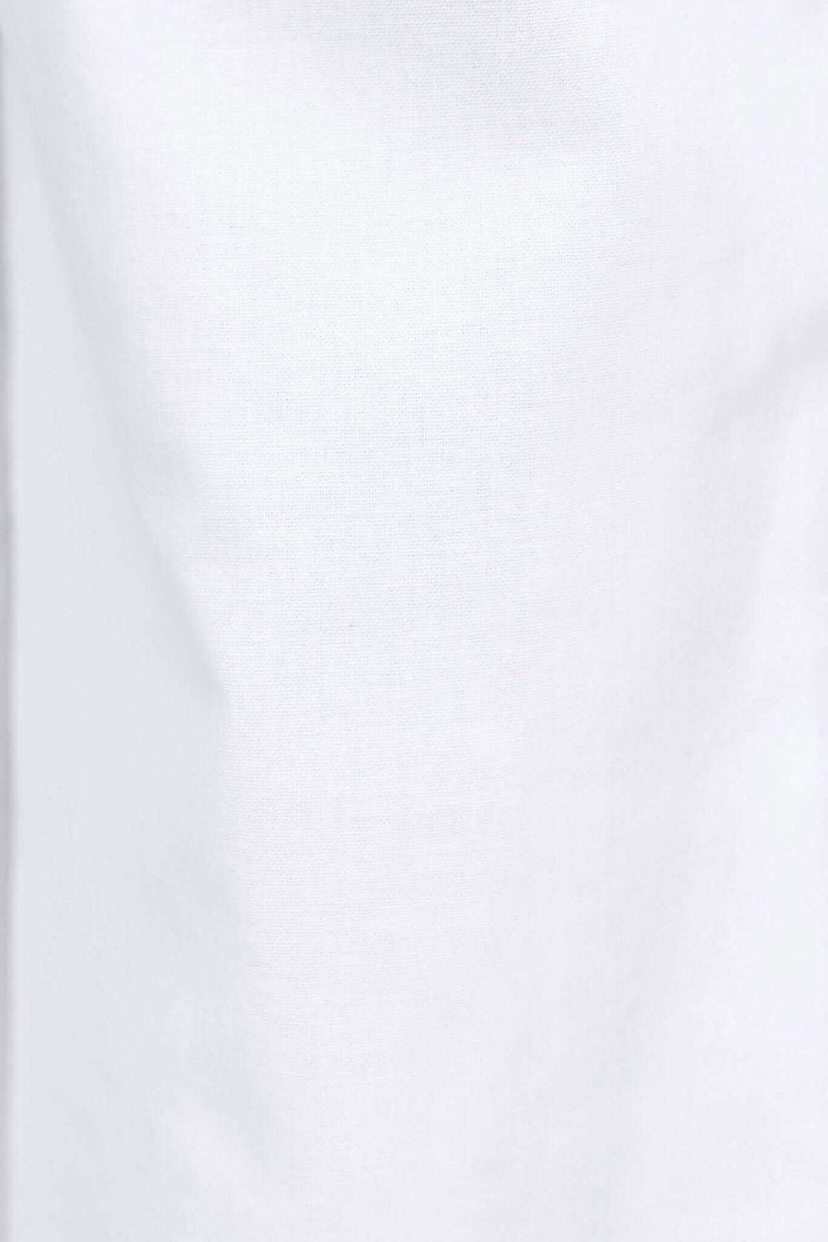Close-up of white fabric texture of Vaylor Pants, showcasing the lightweight and breathable cotton material.