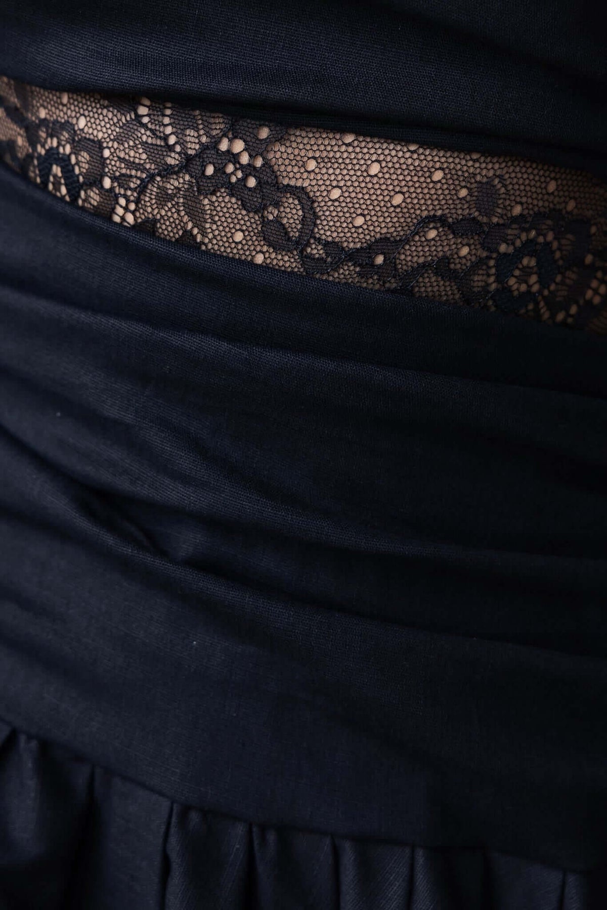 Close-up of lace panel detailing on black Heiress Maxi Dress, showcasing elegant design and texture.