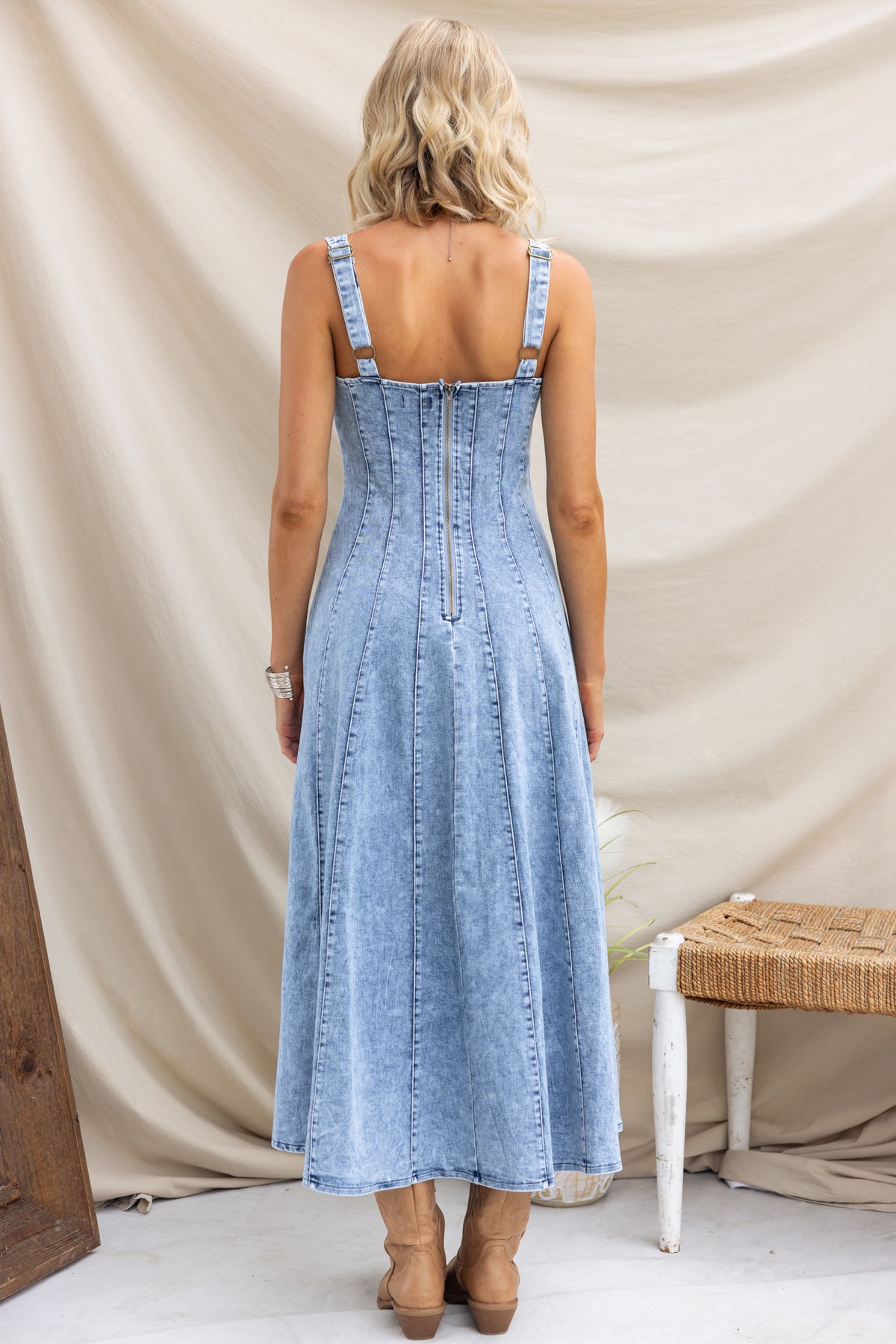 Back view of Annette Maxi Denim Dress showcasing thick adjustable straps and zip-up back, perfect for casual wear.