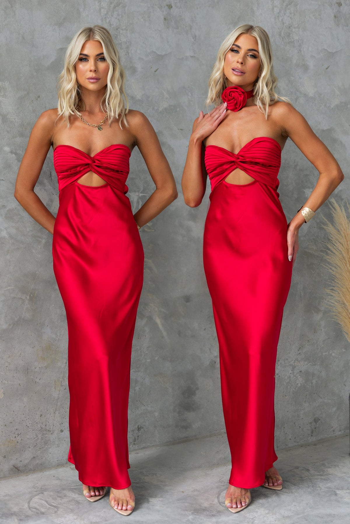 Stylish Lamoura Maxi Dress in vibrant red, featuring a strapless design, cut-out detail, and removable floral brooch.