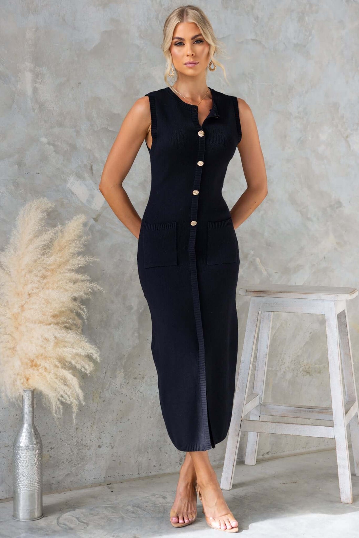 Bari Maxi Dress featuring high neckline, faux buttons, pockets, and front split, crafted from stretchy knit material.