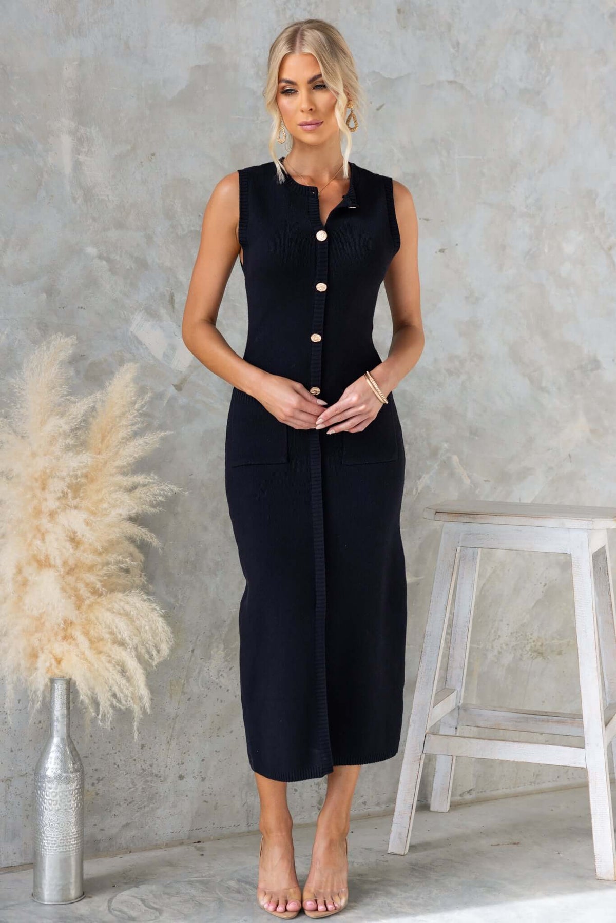 Bari Maxi Dress featuring high neckline, faux buttons, pockets, and front split in stretchy knitted fabric.