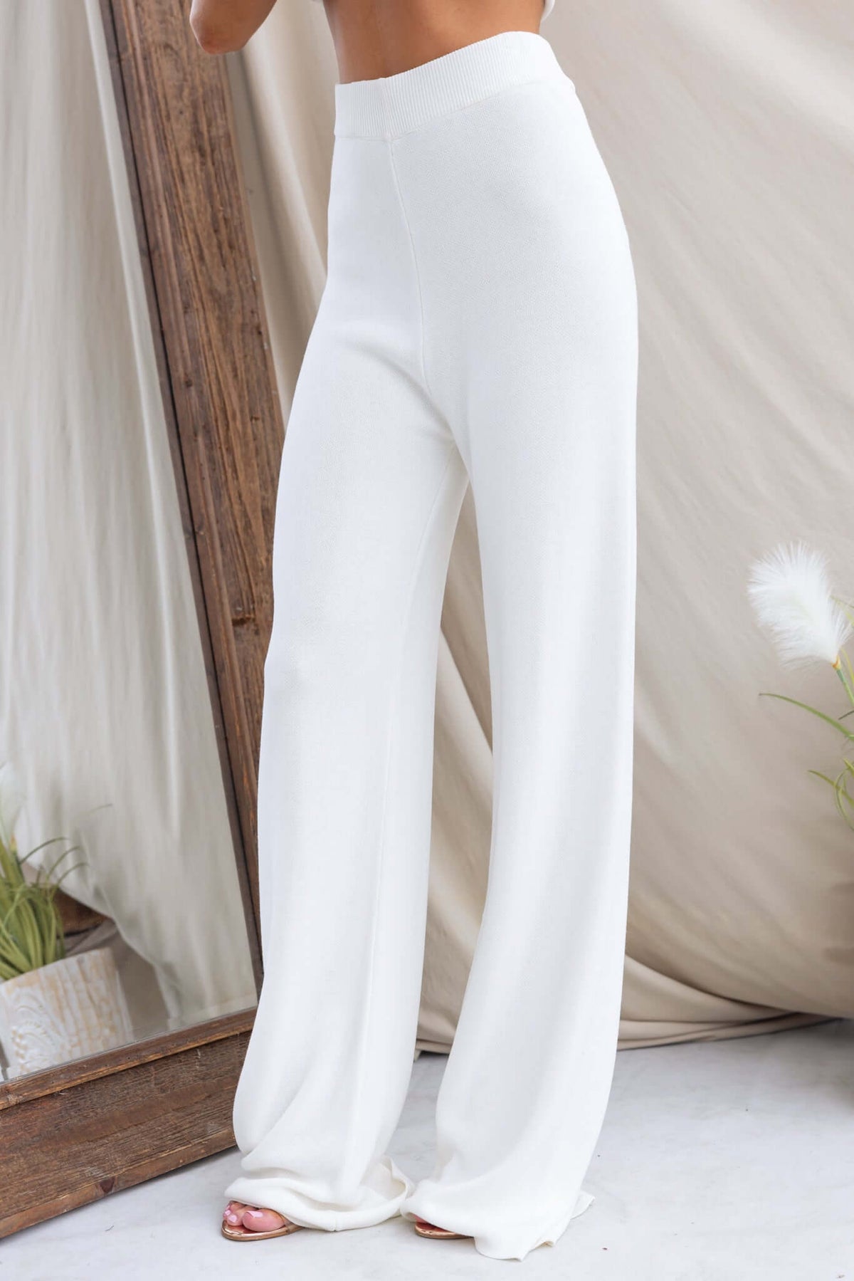 Beacall Pants featuring a mid-high waist fit, elastic waistband, and stretchy knit material in white.