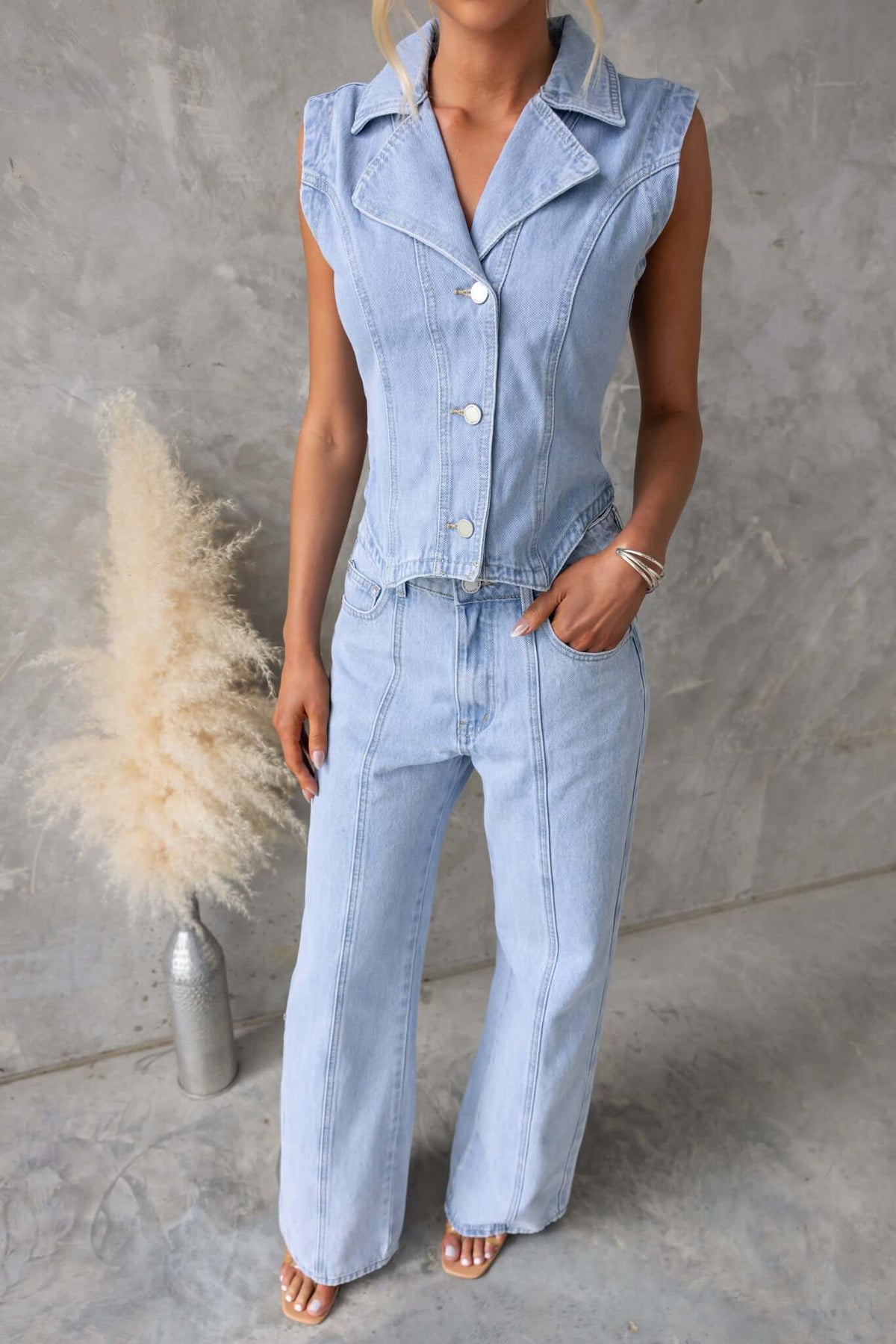 Billie Denim Top featuring a button-up front, collar, and chic mint-green color, styled with casual trousers.