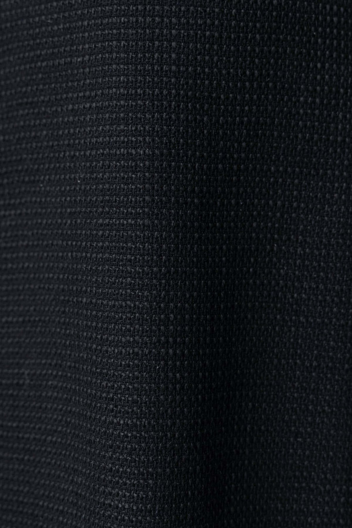 Close-up of black chenille fabric texture, perfect for elegant dress designs like the Jhene Dress.
