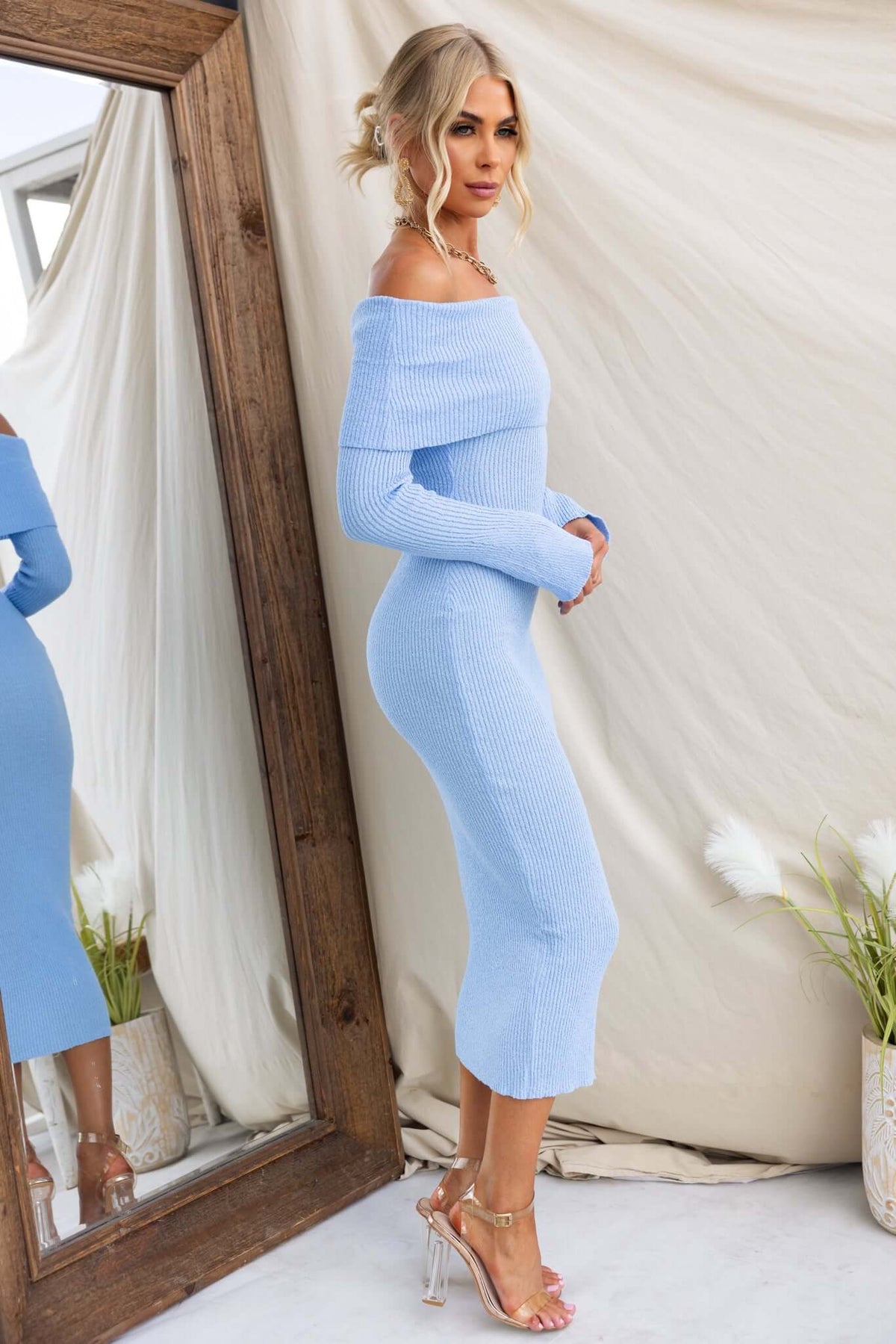 Breeze Midi Dress in light blue, off-shoulder ribbed knit with a standard fit, showcasing elegant side view.