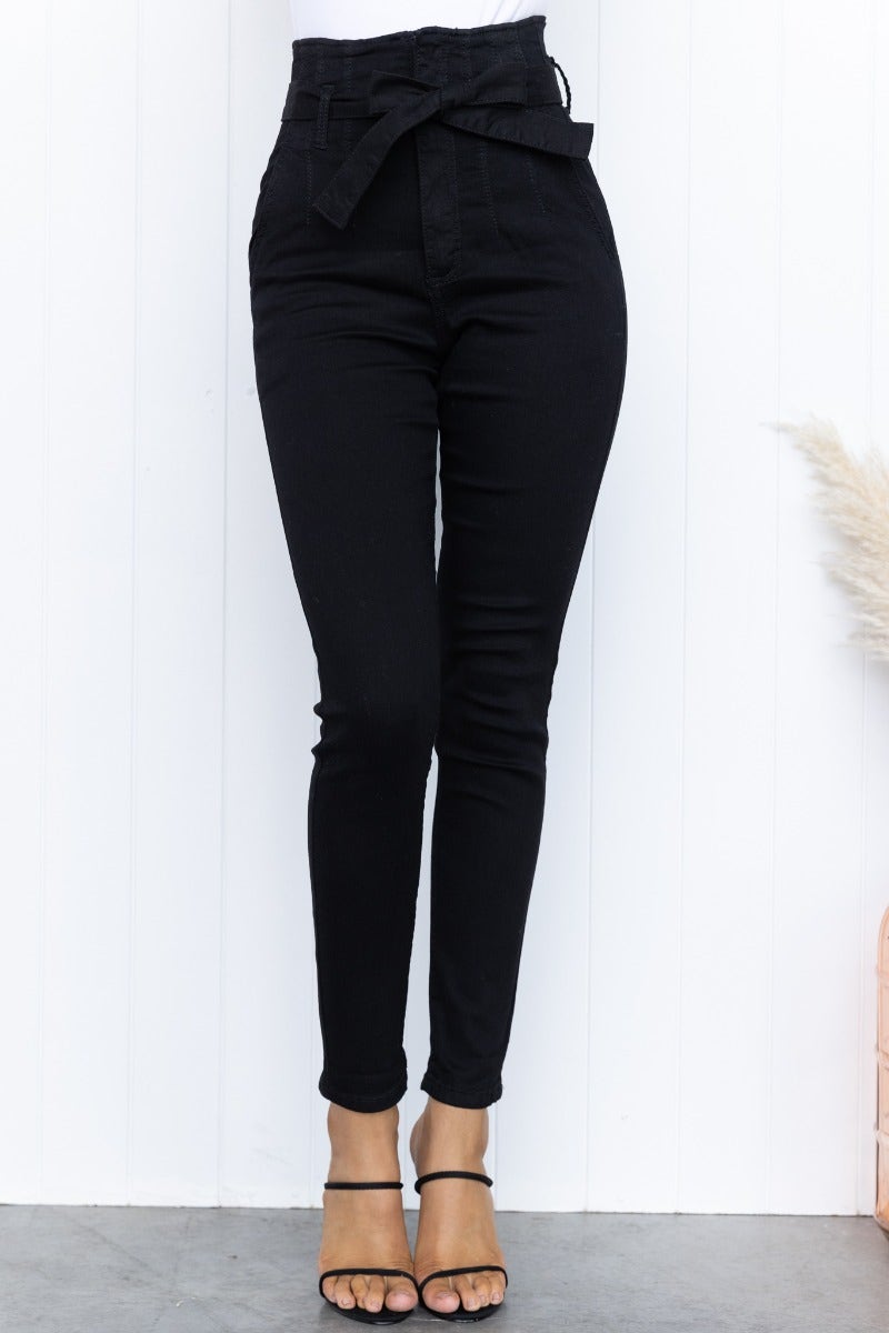 High-waisted black denim jeans with removable tie belt, front & back pockets, firm stretch fit.