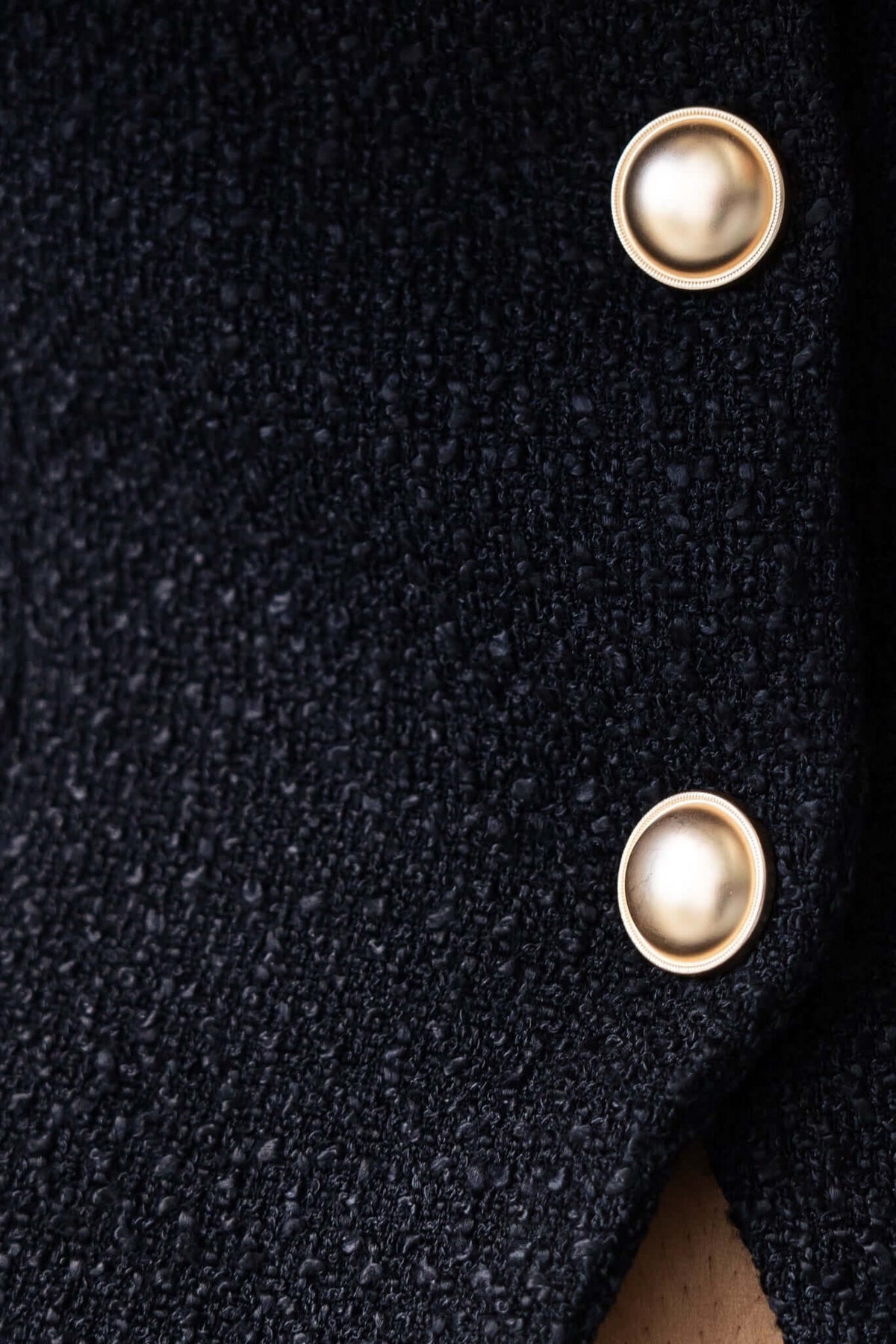 Close-up of the textured chenille fabric with gold button details from the Dearly Set top.