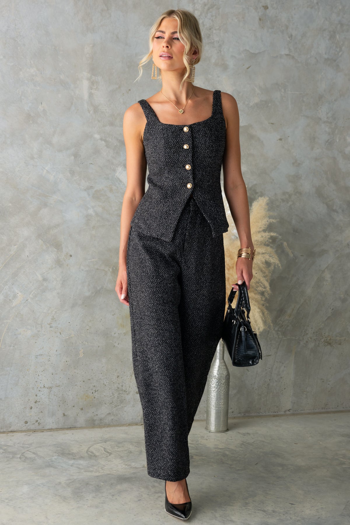 Model wearing the Dearly Set, featuring a square neckline top and mid-high waist pants in textured chenille fabric.