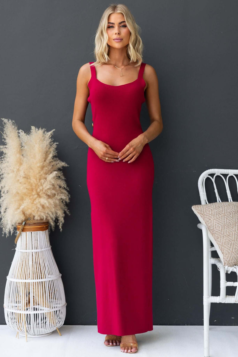 Model wearing a pink Denton Maxi Dress featuring a cut-out back and ribbed stretch material.