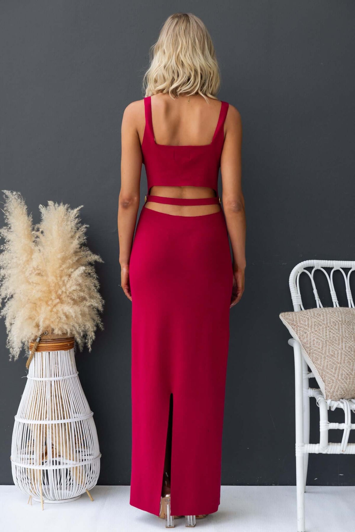 Denton Maxi Dress in red, featuring a back cut-out and split, made from stretch ribbed knit fabric.