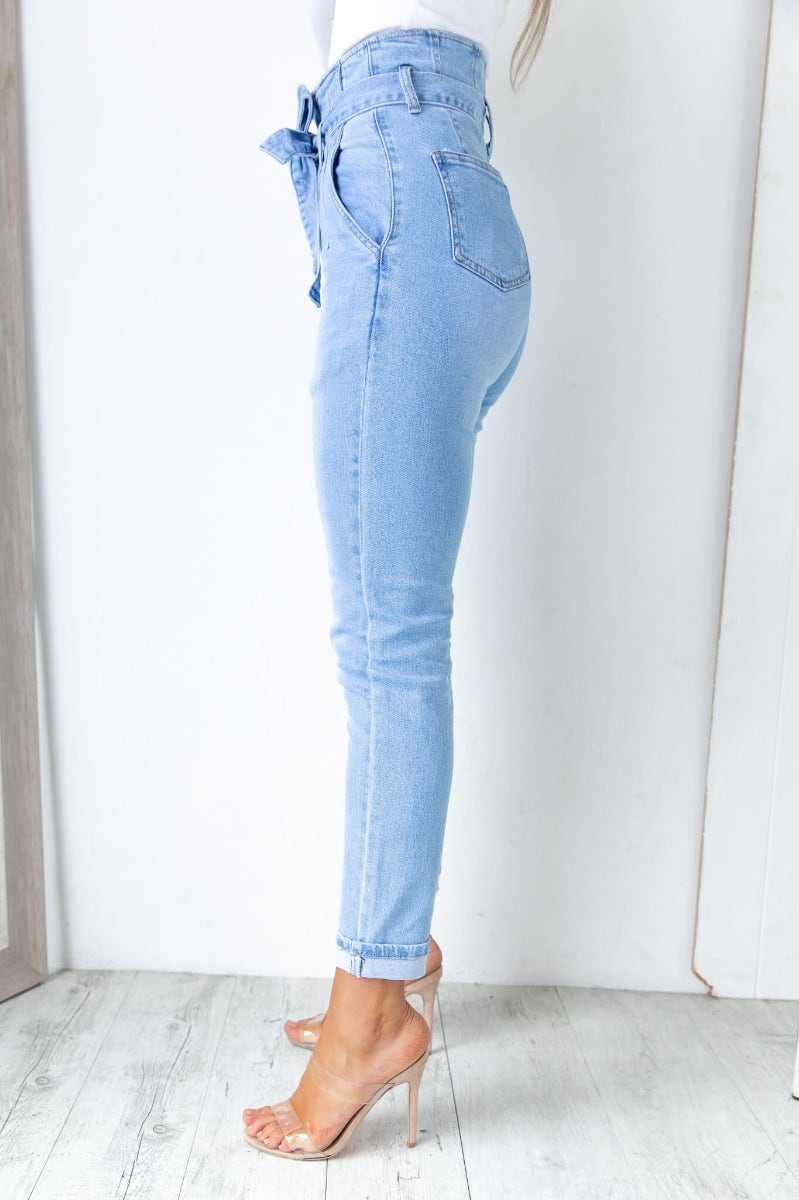 High-waist New Hope Paper Bag Jeans with removable belt, showcasing a side view and light blue denim.
