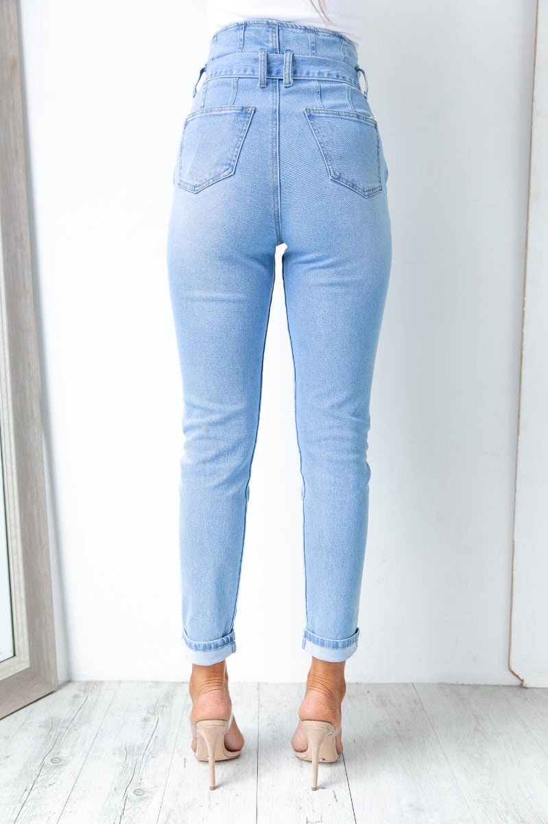 High waist New Hope Paper Bag Jeans in light denim, showcasing back pockets and firm stretch fit.