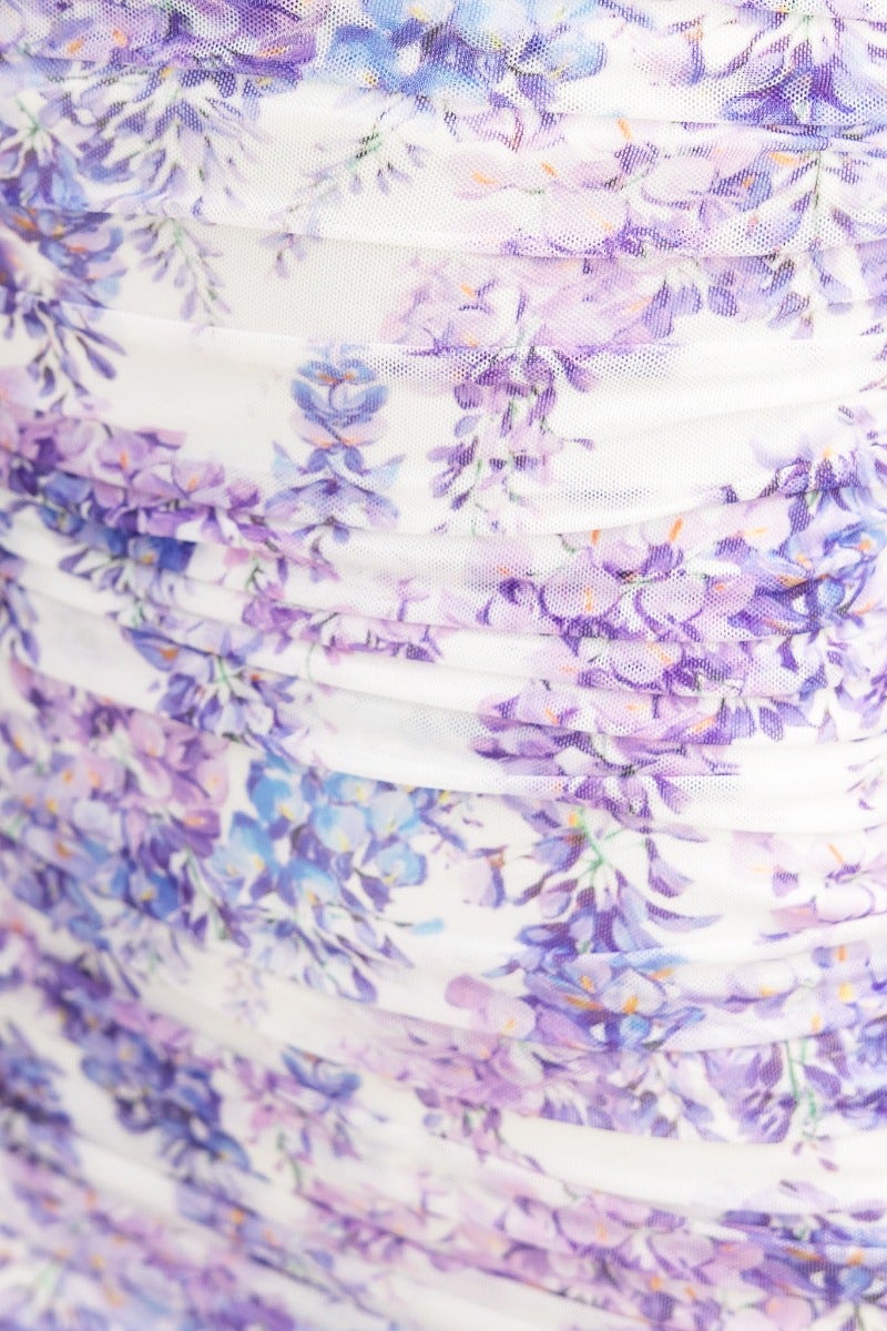 Close-up of Dayara Midi Dress showing floral mesh overlay with ruched detail in purple and white.