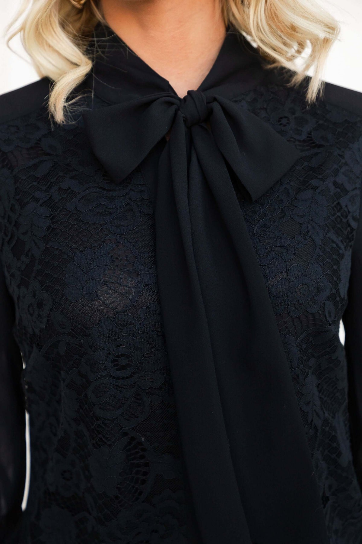 Elijah Shirt featuring a tie neckline and lace detail, shown close-up in black chiffon material.