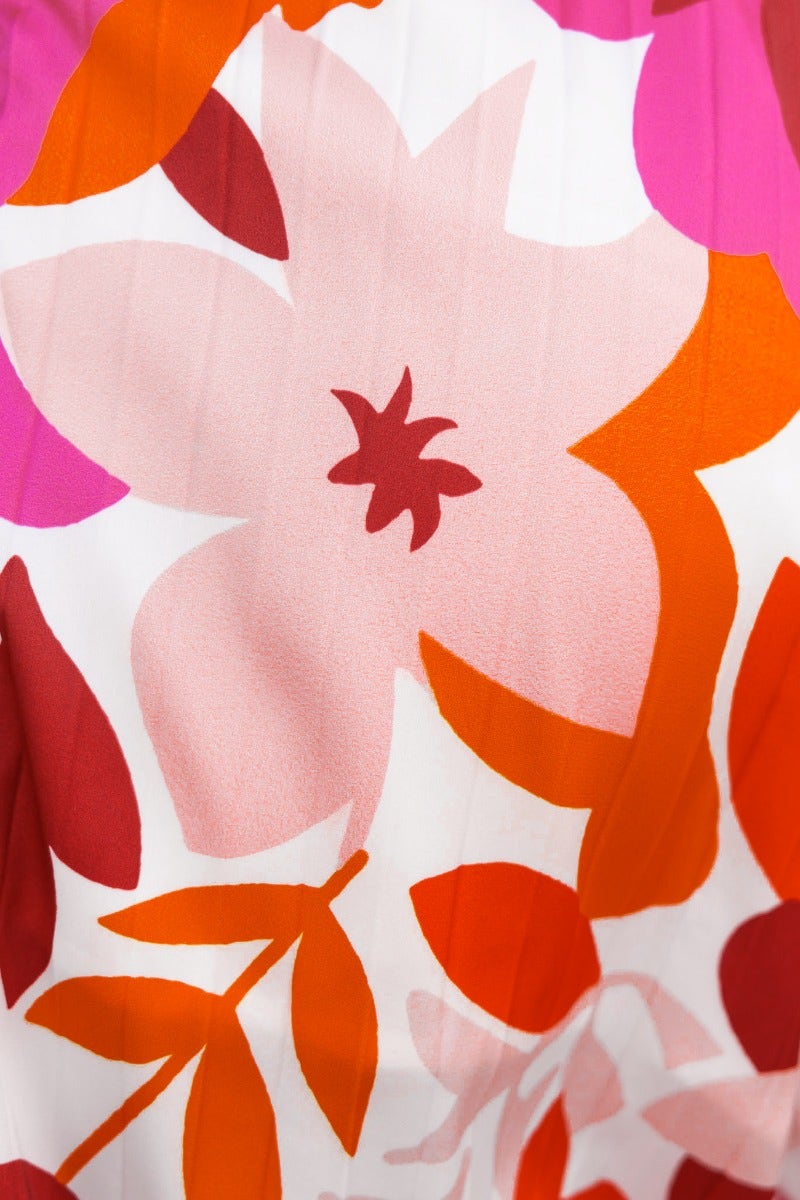 Close-up of vibrant floral print featuring pink and orange flowers on white background, perfect for Kira Set.