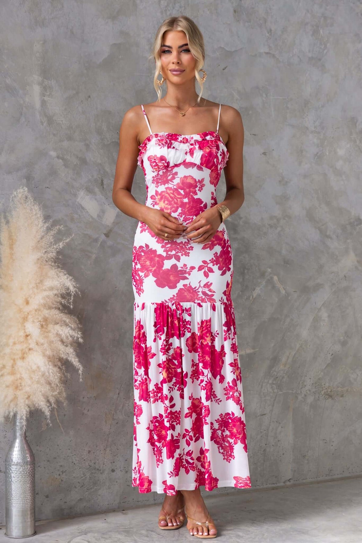 Fabada Maxi Dress with floral print, adjustable straps, and a flowing design, perfect for summer occasions.