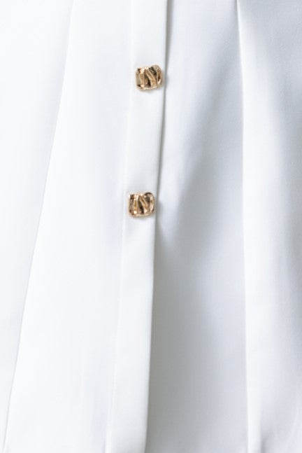 Close-up of faux buttons on the Feist Dress, showcasing the stylish boat neckline and elegant design.