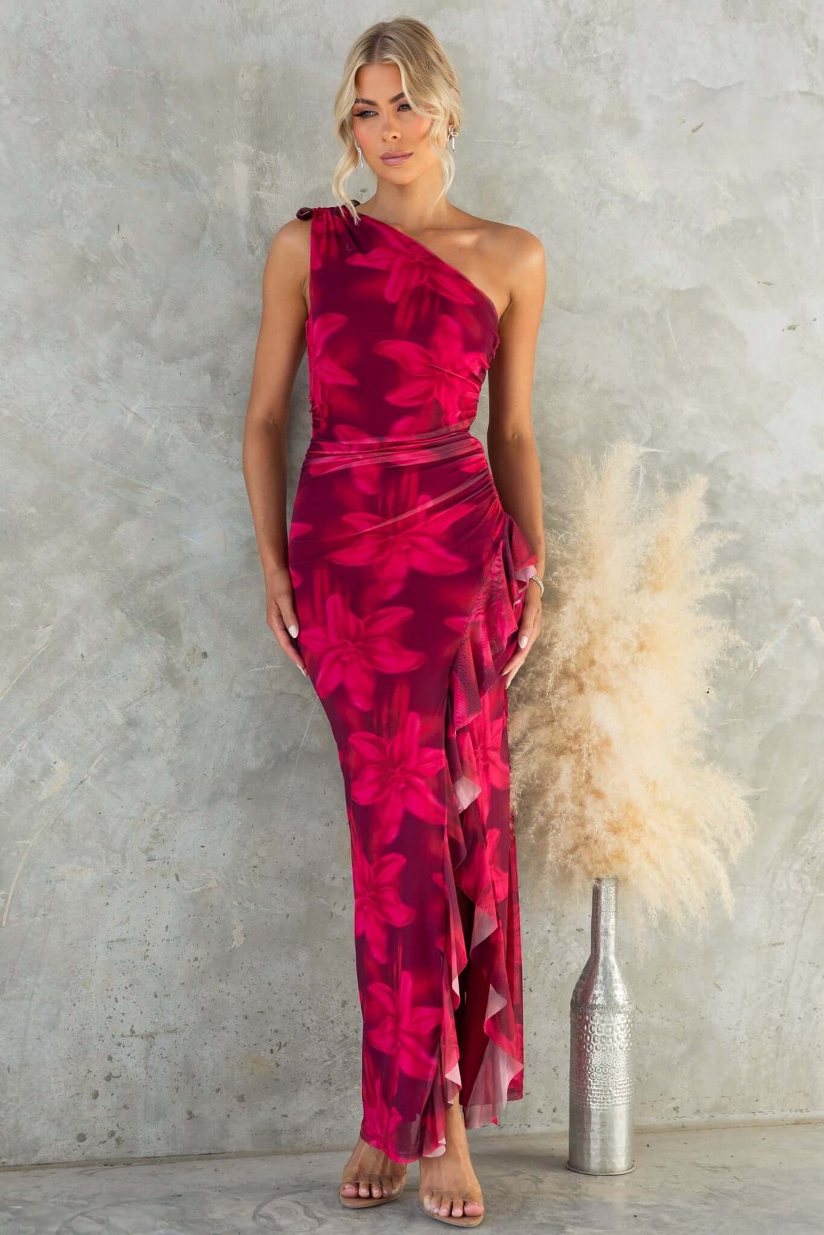 Govanna Maxi Dress featuring a one-shoulder neckline, pink floral design, and front split, ideal for elegant occasions.