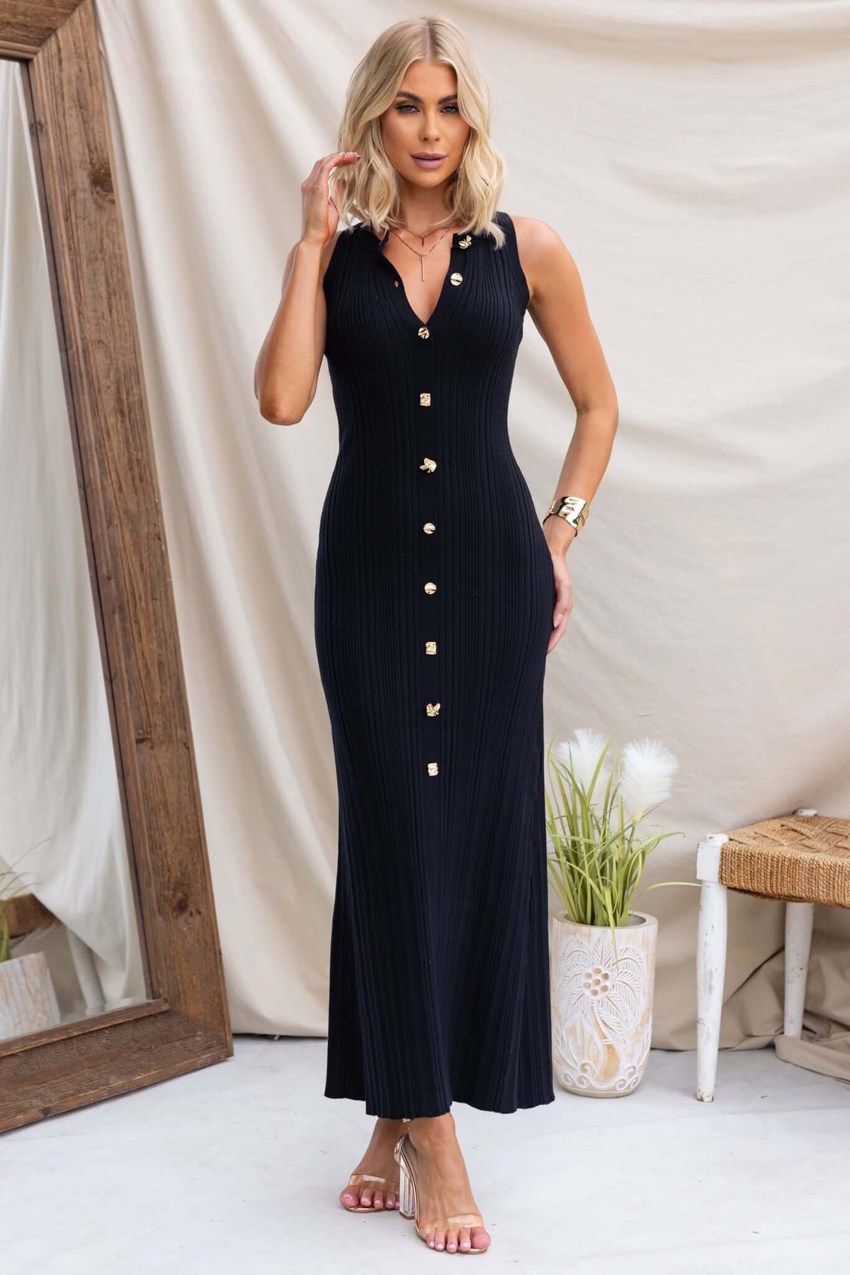 Stylish Hash Maxi Dress featuring high neckline, faux buttons, and a stretchy knit material in black.