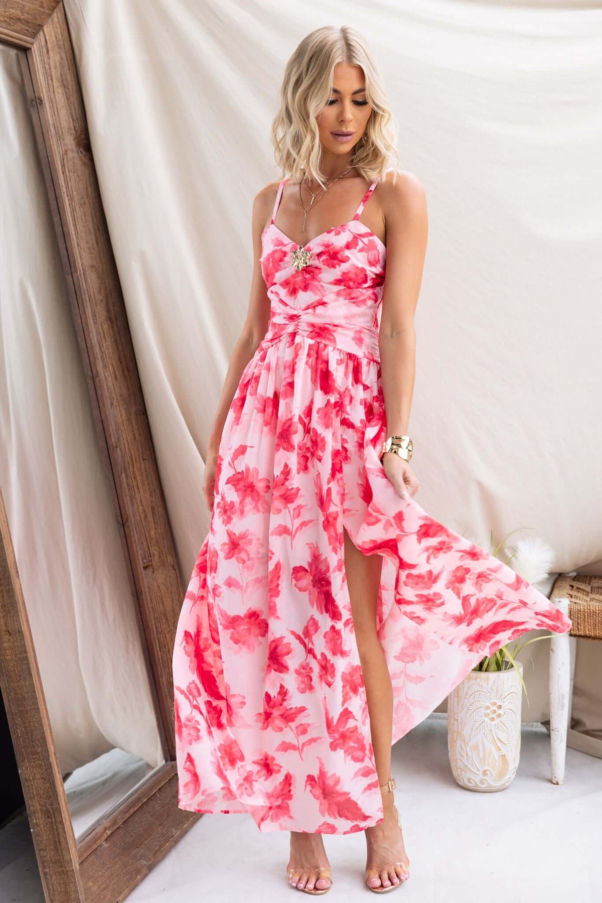 Hazelle Maxi Dress in pink floral print with adjustable straps and front split, showcasing elegant summer style.