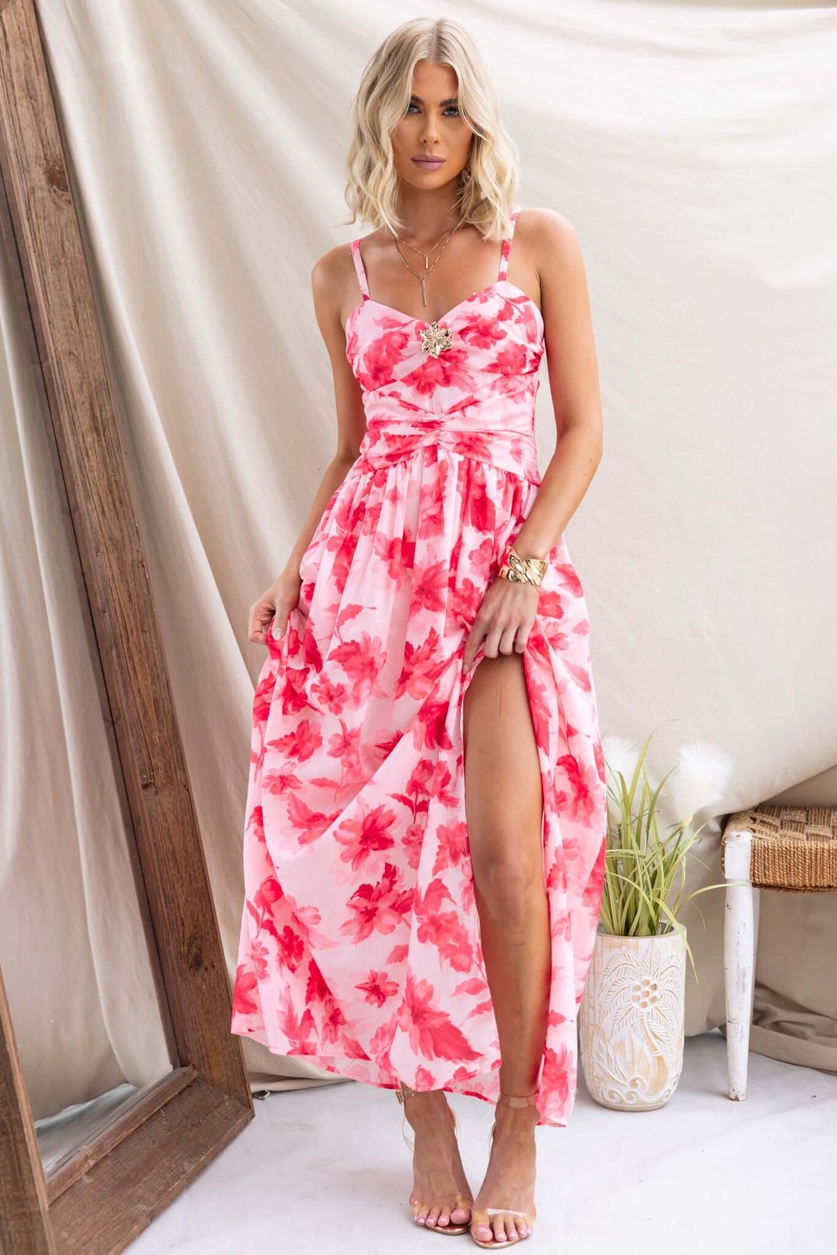 Model wearing Hazelle Maxi Dress with floral print, adjustable straps, and side split.