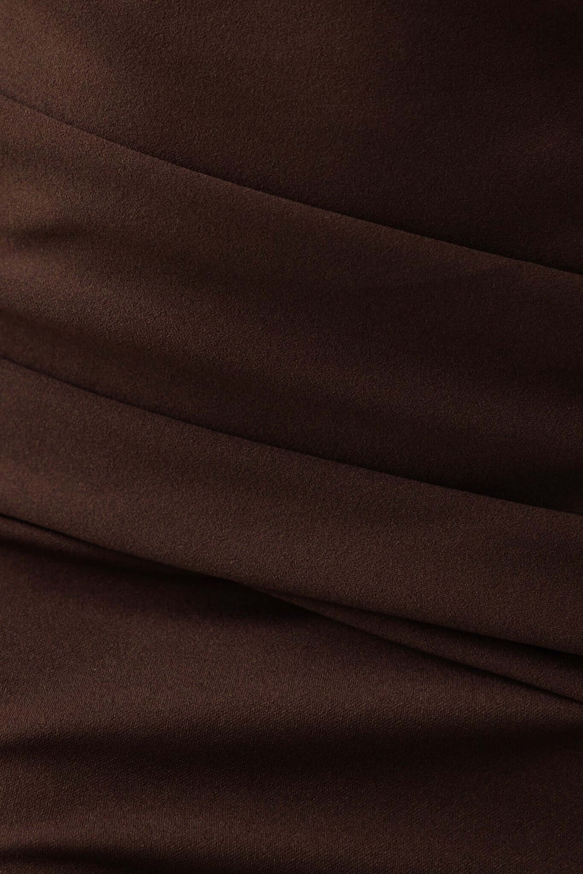Close-up of Hummer Maxi Dress fabric showing smooth, stretchy brown material with elegant draping.