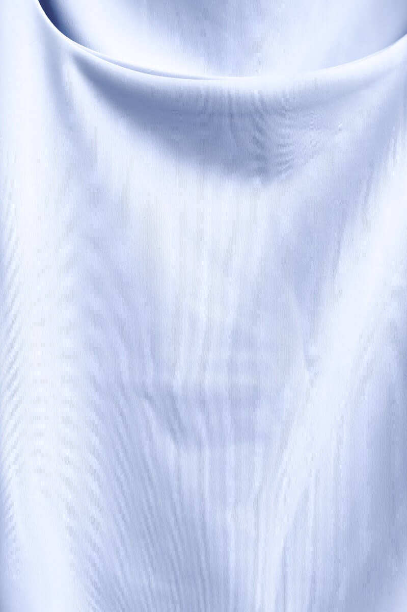 Ice white Lycra feel fabric of the Layla Top with a wide scoop neckline and soft texture.