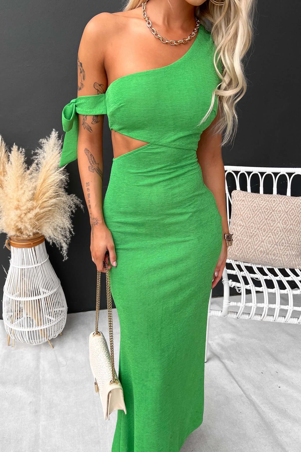 Malian Maxi Dress in vibrant green, featuring one-shoulder neckline, cut-out at waist, and stylish tie detail.