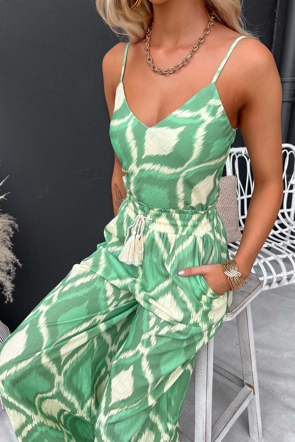 Mason Top featuring adjustable straps and lined bust, styled in a vibrant green ikat print.