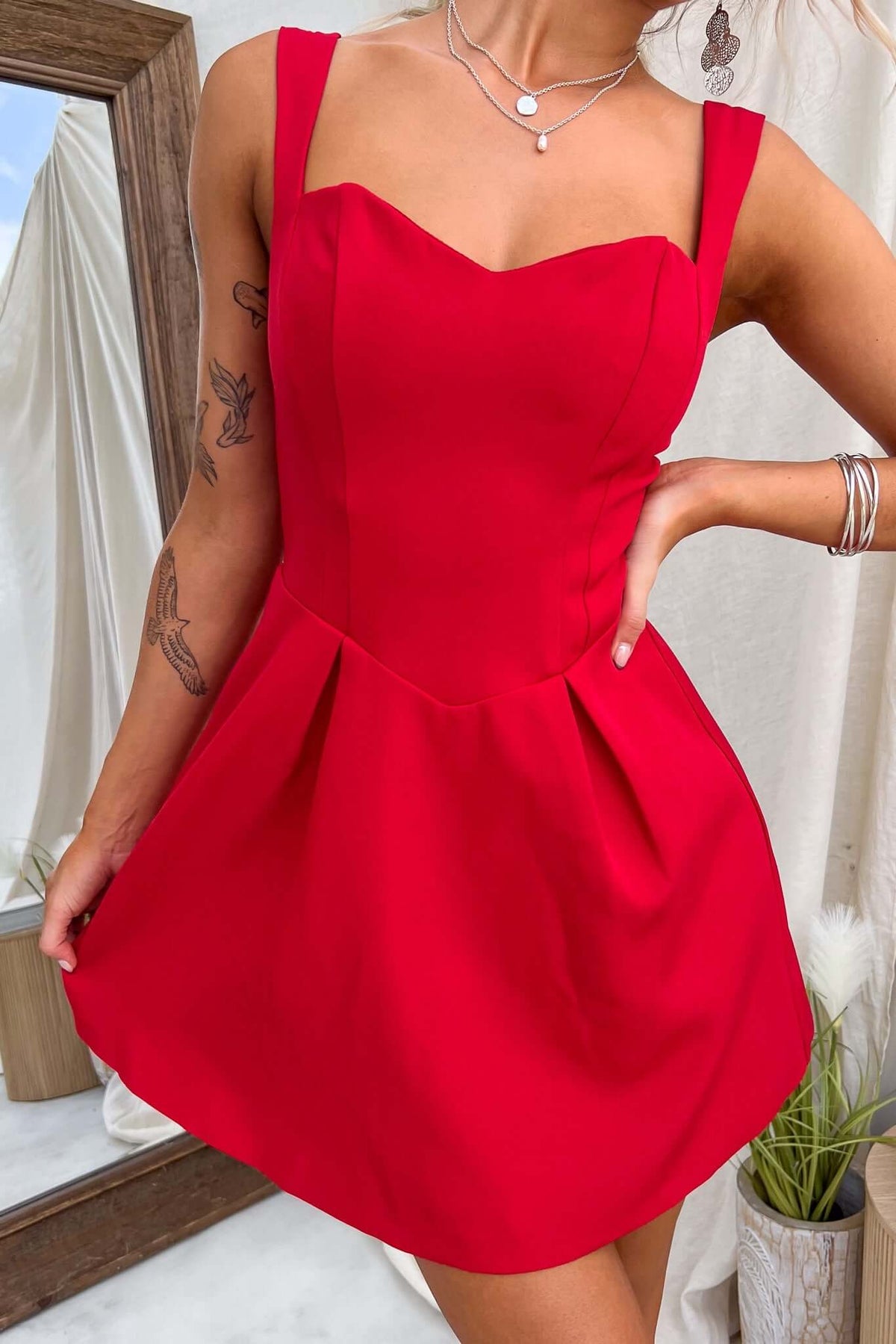 Franklin Dress in vibrant red with adjustable straps and pleated skirt, perfect for summer occasions.