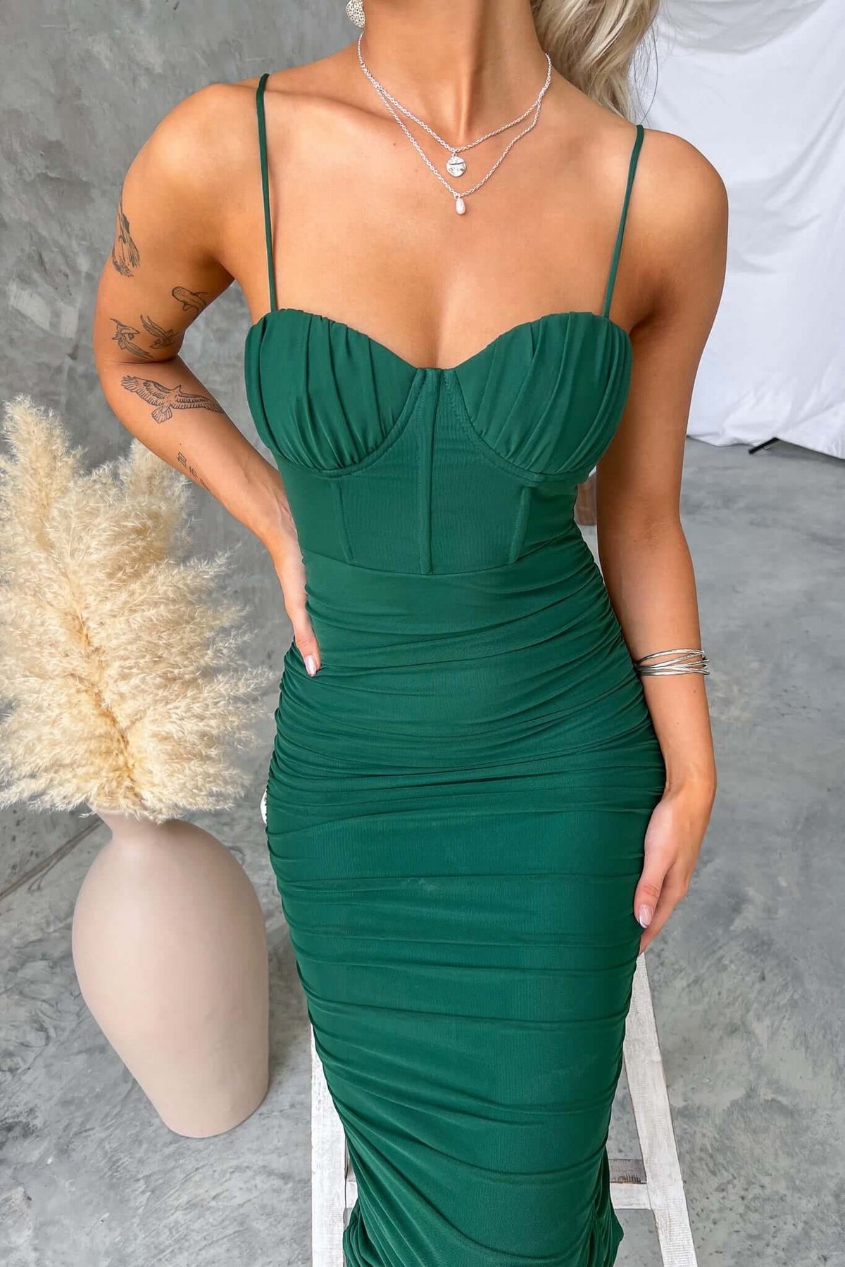 Overboard Midi Dress in green with padded bust, adjustable straps, and mesh overlay worn by a model.