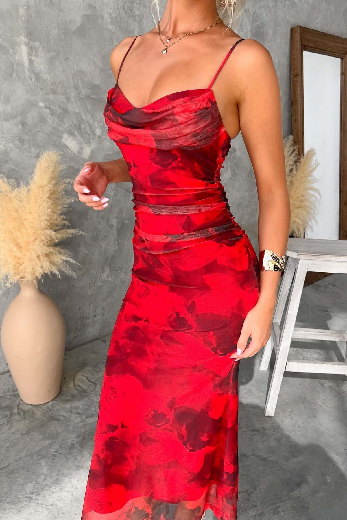 Emiliano Midi Dress in red floral design, featuring adjustable straps and a fitted silhouette.