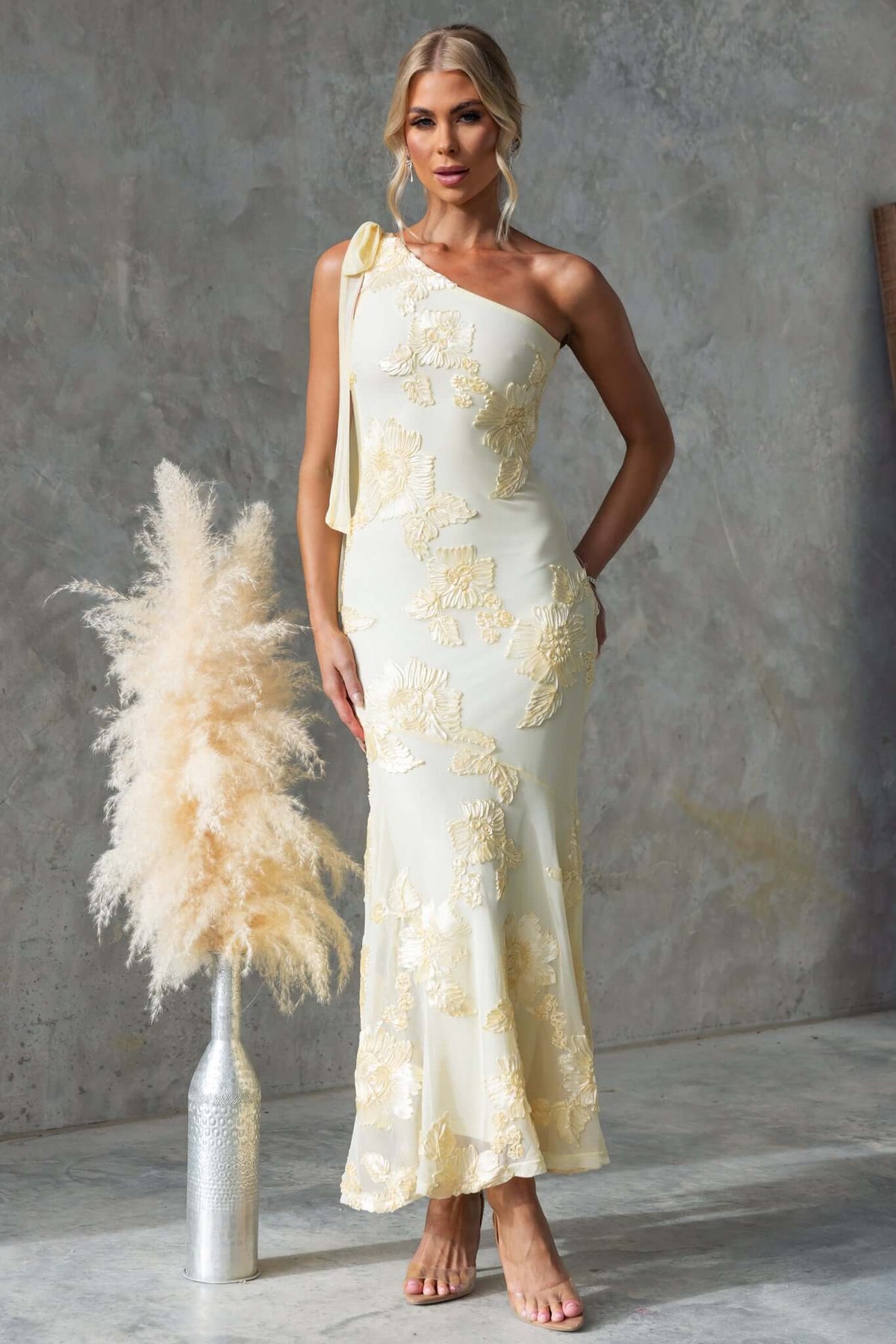 Inspire Maxi Dress in embroidered material, featuring one-shoulder neckline and tie, stylish and elegant for any occasion.